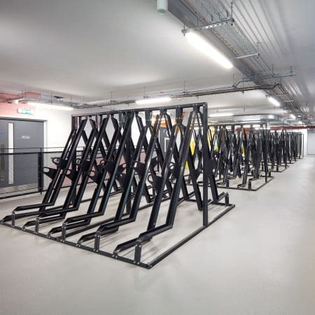 Semi Vertical Cycle Racks installed in an End of Trip Cycle Storage Facility in RAL Jet Black