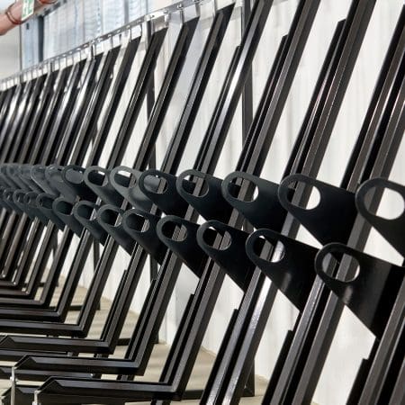 Semi Vertical Cycle Racks installed in an End of Trip Cycle Storage Facility in RAL Jet Black
