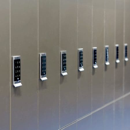 Close up of the Ojmar OCS Pro Lock on a row of Camden Lockers in colour bronze installed in a cycle storage facility