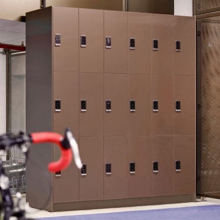 3X6 Row of Camden Lockers in a bronze colour installed in an underground cycle storage area for end of trip facilities
