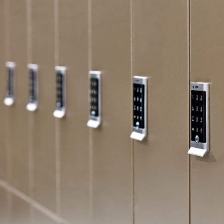 Close up of the Ojmar OCS Pro Lock on a row of Camden Lockers in colour bronze installed in a cycle storage facility