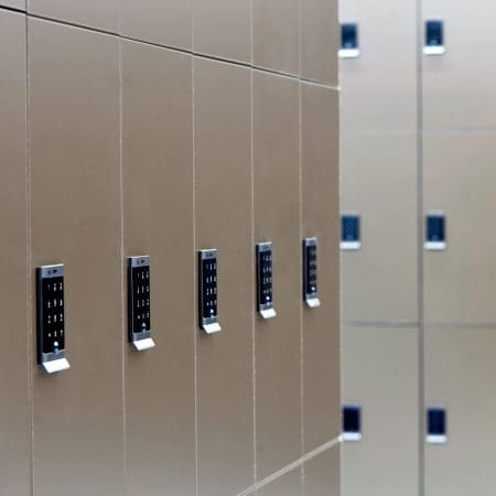 Close up of the Ojmar OCS Pro Lock on a row of Camden Lockers in colour bronze installed in a cycle storage facility
