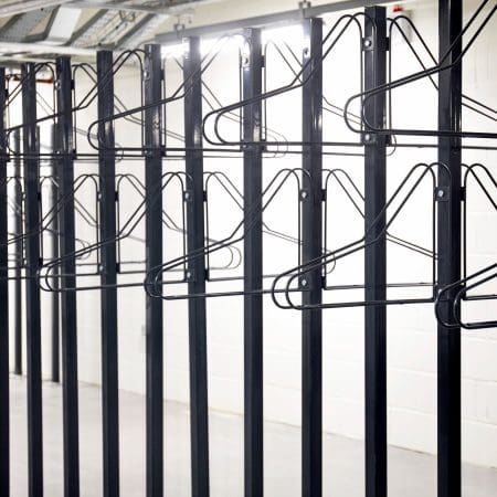 close up of solo vertical bike racks stored in underground cycle storage
