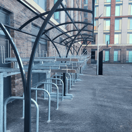 20 space Chelsea two-tier cycle shelter with black RAL and galvanised Sheffield stands