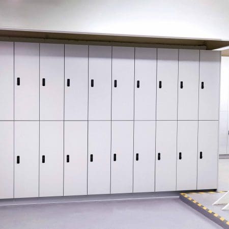 Row of white Camden Lockers installed in an underground cycle storage facility