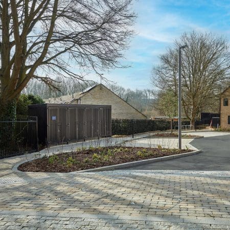 Greenwich Cycle Enclosure with wood cladding in RAL black installed at a residential property