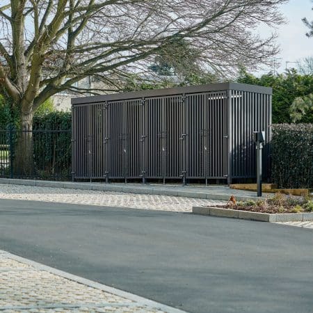 Greenwich Cycle Enclosure with wood cladding in RAL black installed at a residential property