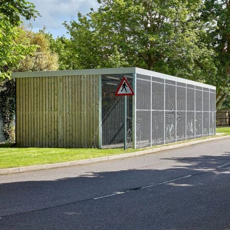 a large wooden cycle shelter with metal fencing