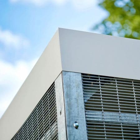 close up of a wooden bike shelter fascia and mesh fencing