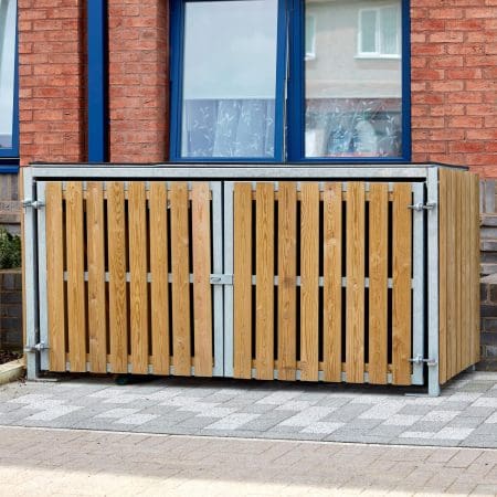 close up shot of the Amazon Eco 2 Cycle Locker installed out of a newly built brick apartment complex where the locker is sitting directly outside