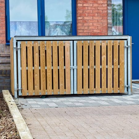 close up shot of the Amazon Eco 2 Cycle Locker installed out of a newly built brick apartment complex