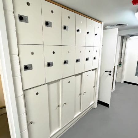 Hackney Accessible Lockers in white installed in an underground cycle storage area