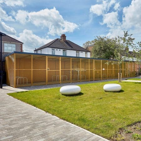 yellow steel mesh cycle shelter outside