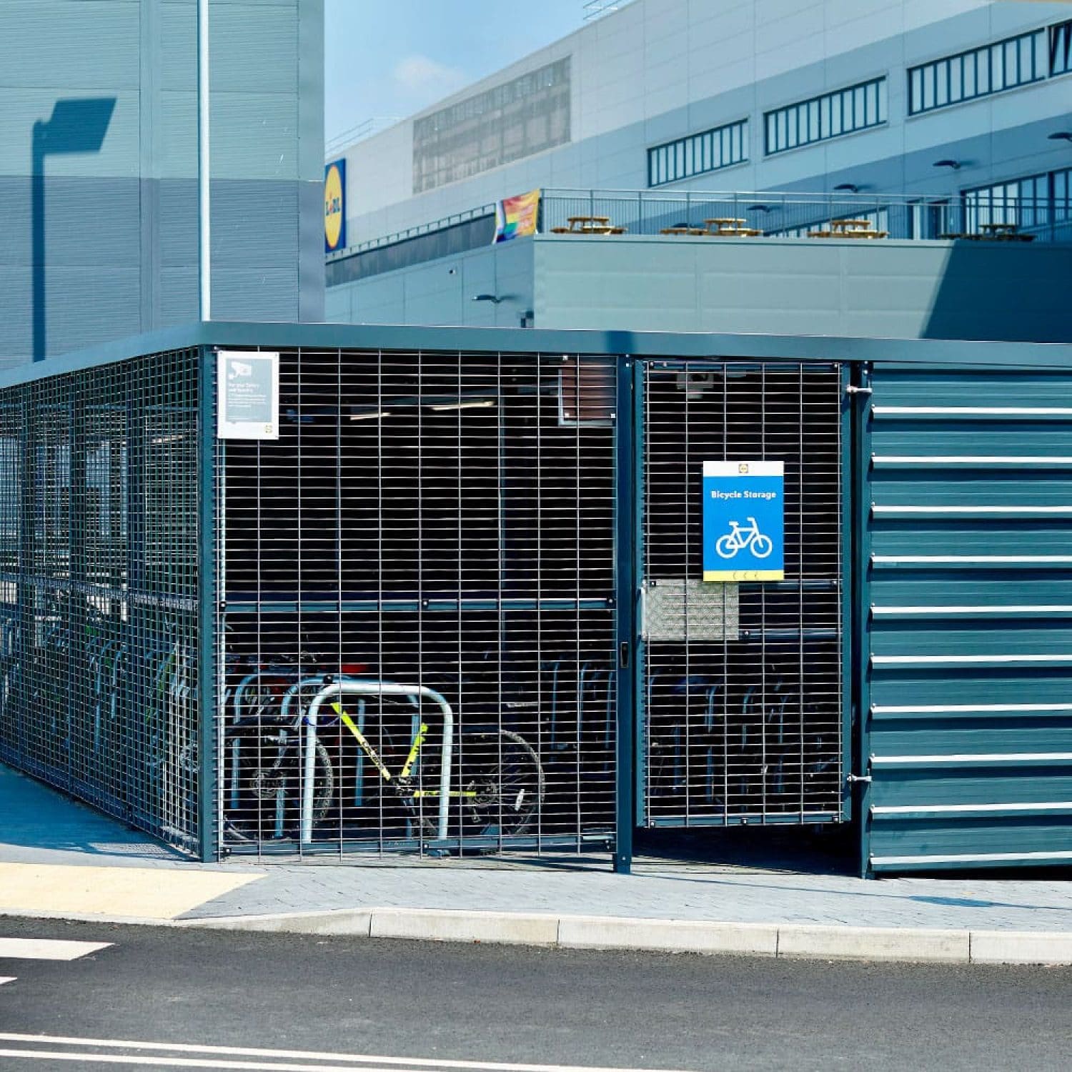 a premium metal bicycle storage shed on a street