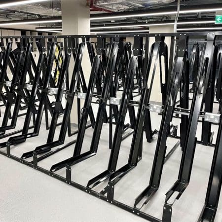 RAL Black Semi Vertical E-Bike Rack installed in underground cycle storage