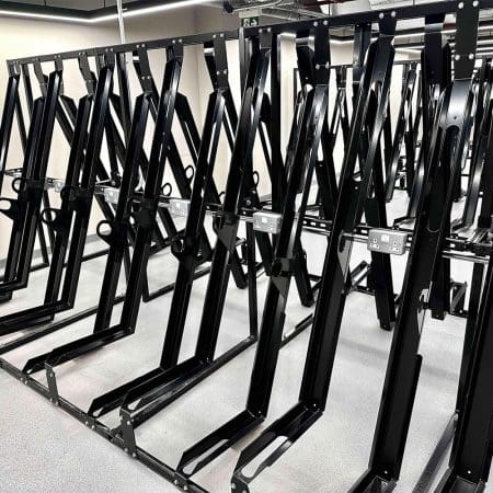 RAL Black Semi Vertical E-Bike Rack installed in underground cycle storage