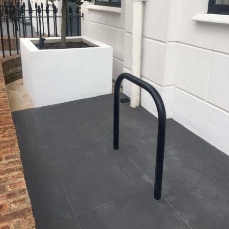 Black galvanised Sheffield Cycle Stand installed outside of a residential property
