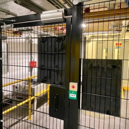 close up of the a door with twin wire mesh partitioning and automatic locking system