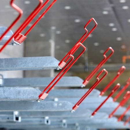 close up of Two Tier Cycle Racks with Red EasyGrip Handles installed