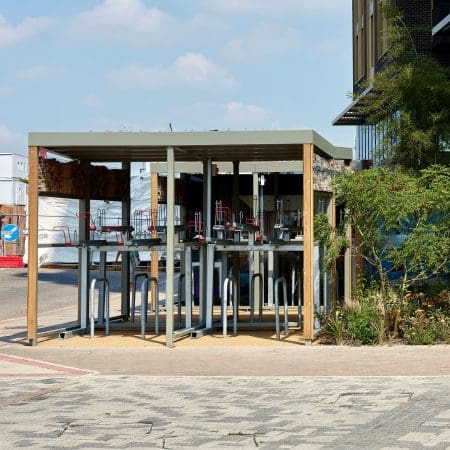 Open front bespoke Two Tier Shelter with lower Sheffield stands and upper Two Tier Cycle Racks with EasyGrip RAL red handles