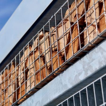 Close up of the habitat panel shelter with mesh cladding installed in an commercial setting